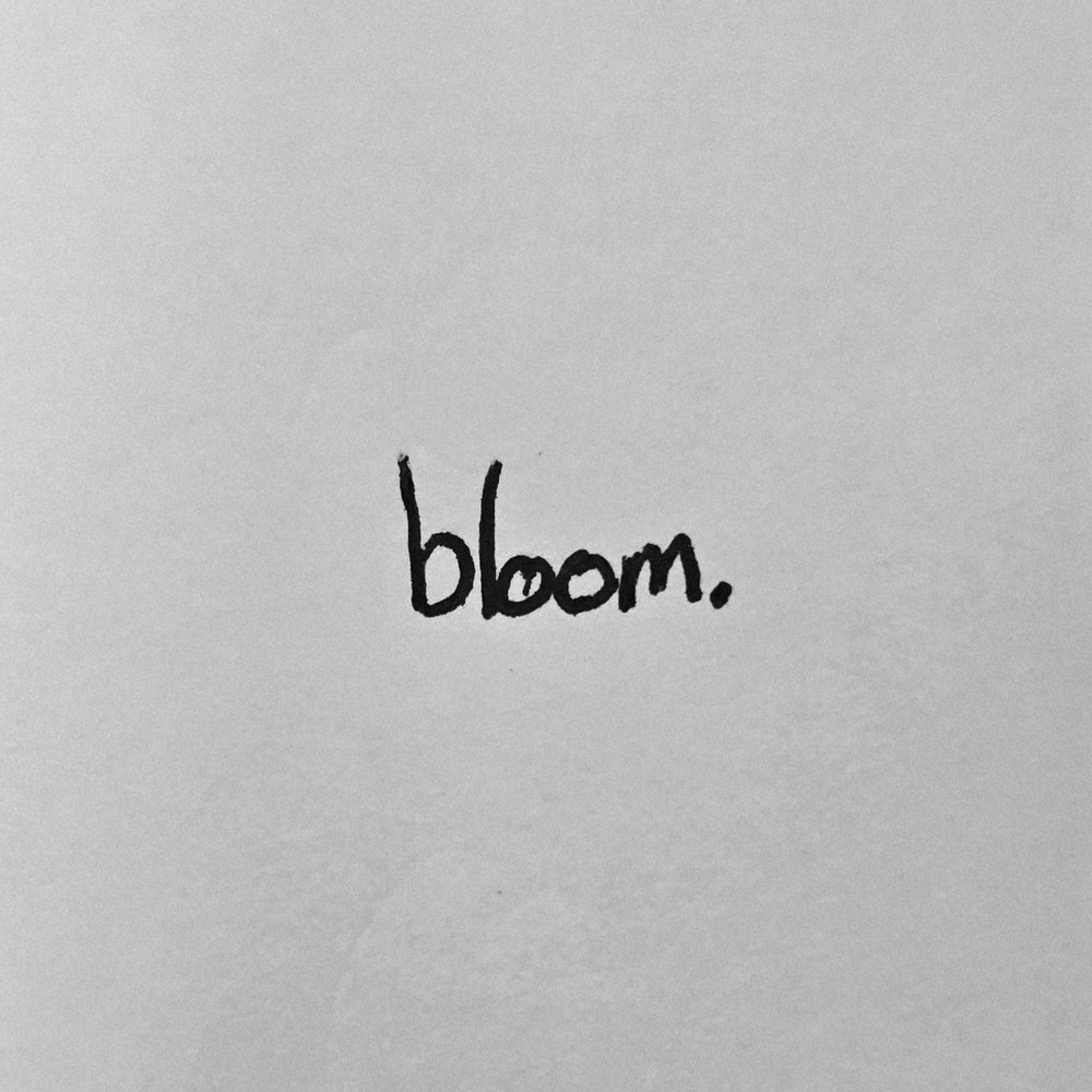 bloom. single cover: the word bloom handwritten in black ink on grey paper